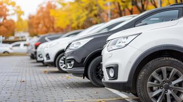 A row of cars parked in a parking lot photo
