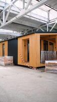 Development of new prefabricated modular wooden houses. Vertical video