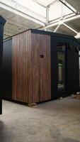 Modern mobile prefabricated modular home at a construction site. Vertical video