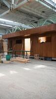 Prefabricated mobile modular container house in factory. Vertical video
