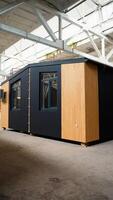 Prefabricated mobile modular container house in factory. Vertical video