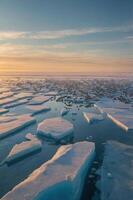 A serene view of fragmented ice floes on a tranquil water surface during sunset. photo