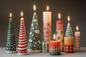 Assortment of Burning Christmas Candles with Festive Designs photo