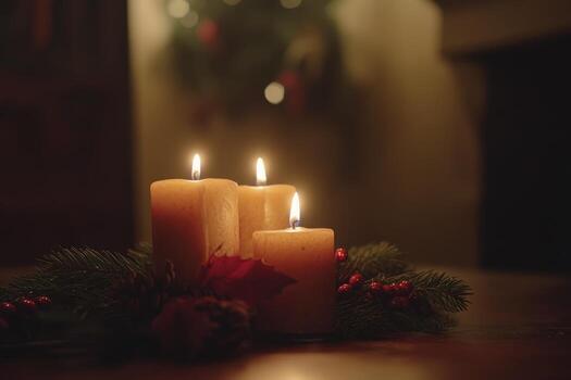 Three Burning Candles Surrounded by Pine Branches and Red Berries photo
