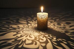 A Burning Candle Casting an Intricate Floral Shadow on a Surface photo