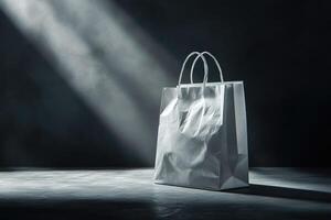 Crumpled White Paper Shopping Bag on a Dark Background with Light Rays photo