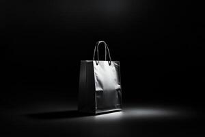 A Single Gray Paper Shopping Bag on a Black Surface photo