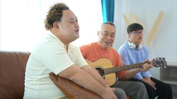 A family with an autistic child enjoys singing and dancing together at home during the holidays photo