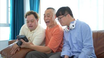 A family with an autistic child enjoys singing and dancing together at home during the holidays photo