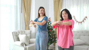 Two sister enjoys dancing together at home during the holidays photo