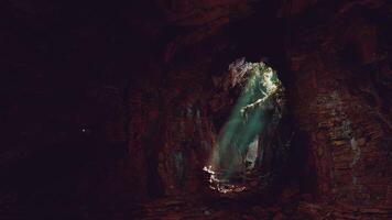 A mysterious cave illuminated by a beam of light video