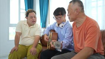 A grandfather with grandchild enjoys singing and dancing together at home during the holidays photo