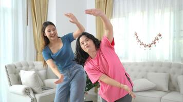 Two sister enjoys dancing together at home during the holidays photo