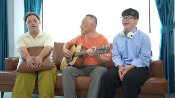 A family with an autistic child enjoys singing and dancing together at home during the holidays photo