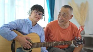 A family with an autistic child enjoys singing and dancing together at home during the holidays photo