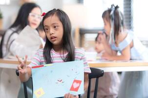 Portrait of special students doing learning activities in a special classroom photo