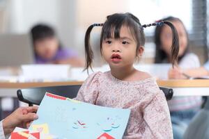 Portrait of special students doing learning activities in a special classroom photo