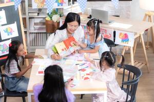 A group of special students doing learning activities in a special classroom photo