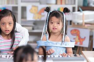 Portrait of special students doing learning activities in a special classroom photo
