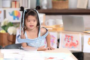 Portrait of special students doing learning activities in a special classroom photo