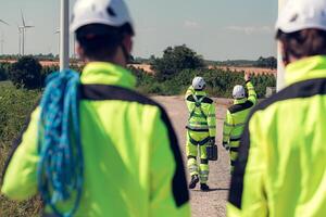 The engineering and technical team is preparing to install a large wind turbine to convert wind energy into electricity photo