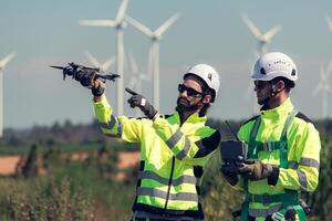 The engineering team is surveying the area to install a large wind turbine for converting wind energy into electricity photo