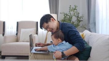 Father and son play together after dad comes home from work photo