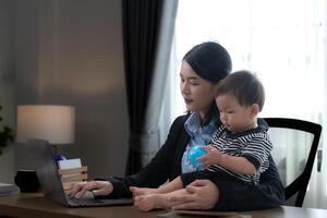 A business mother and his duty to take care of his children while working photo