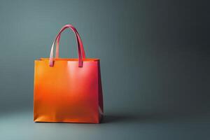 Orange Shopping Bag with Pink Handles on Grey Background photo
