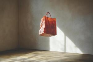 Orange Shopping Bag Hanging on a Wall with a Wood Floor photo