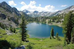 A serene mountain lake nestled amongst towering peaks and lush greenery photo