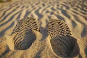 Footprints of a Shoe Embedded in Sand photo