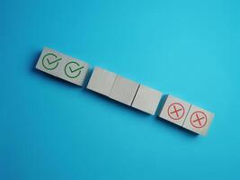 Make Right and Wrong Choices on Empty Wooden Block photo