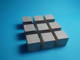 Cubes arranged in a square shape on a blue background photo