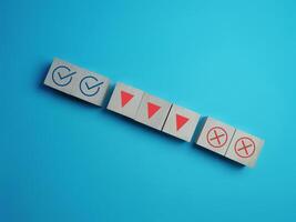 Decide on the downtrend, true and false with the down arrow on the block wood photo