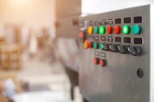 Control panel with multi-colored buttons to control production equipment and production line, copy space for texr photo