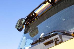 Additional mirror in the truck for viewing the blind spots of the car. Blind spot in trucks, dirty windshield photo