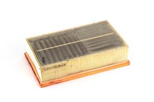 Dirty car air filter on a white background, isolate. The concept of replacing the filter element according to the car maintenance regulations, close-up photo