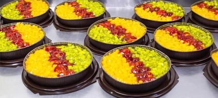 Fresh and juicy pies with pineapple and kiwi fruit with strawberries in syrup. Fresh summer desserts, background, delicious photo