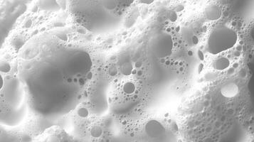 Frothy white foam creates captivating patterns as bubbles rise, inviting calmness and reflection photo
