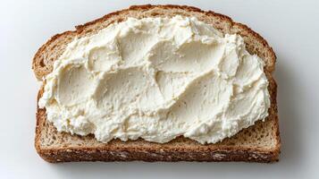 Creamy spread atop fresh whole grain bread creates a delightful snack experience photo