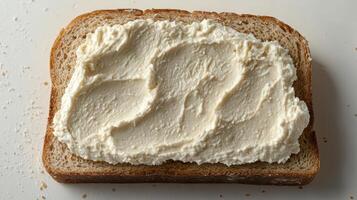 Butter cream spread artfully layered on fresh bread at home kitchen setting photo