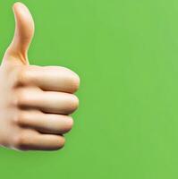 Positive vibes expressed through a thumbs up on a vibrant green background photo