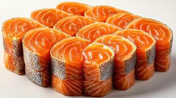 Succulent salmon sushi rolls arranged artistically on a pristine surface photo