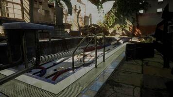 An abandoned and dilapidated swimming pool inside a neglected building video