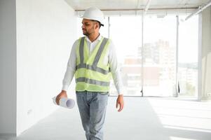 Portrait of a Indian engineer posing at the camera photo
