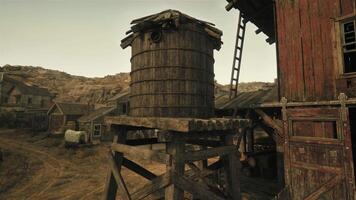 An historic wooden building with a charming water tower beside it video