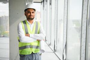 Portrait of a Indian engineer posing at the camera photo