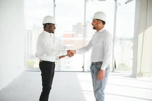 Group of multi ethnic engineer construction site worker meeting at workplace photo