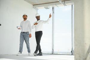 Group of multi ethnic engineer construction site worker meeting at workplace photo
